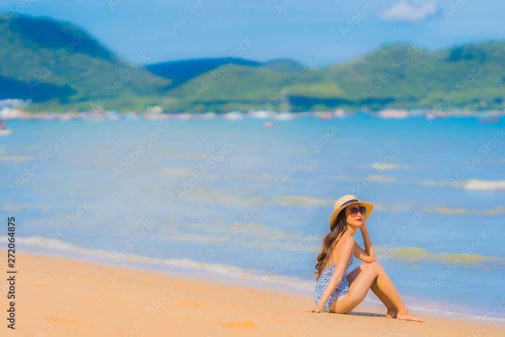 Portrait beautiful young asian woman happy smile relax on the tropical beach sea ocean for leisure travel Portrait beautiful young asian woman happy smile relax on the tropical beach sea ocean for leisure travel