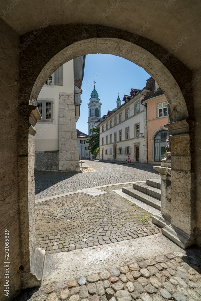 historic old town in the Swiss city of Solothurn with a view of the Rathausplatz and the cathedral behind