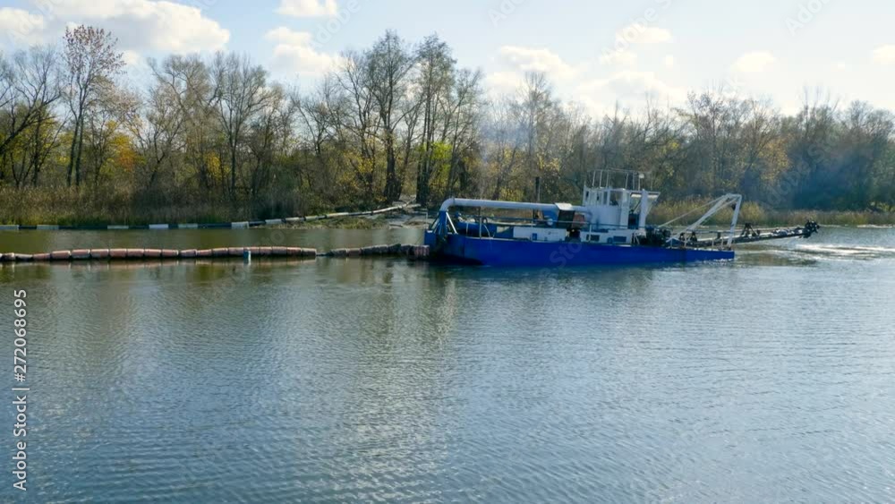 Suction dredger. Ship sailing, removing dirt, mud, sand, algae, garbage from the bottom of the river. The channel getting dredged deep enough. 4K Suction dredger. Ship sailing, removing dirt, mud, sand, algae, garbage from the bottom of the river. The channel getting dredged deep enough. 4K