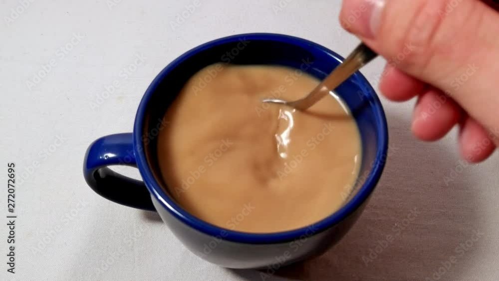 Morning routine, instant coffee stirring preparation, close up shot Morning routine, instant coffee stirring preparation, close up shot