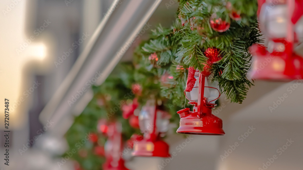 Fototapeta premium Panorama Exterior of a festive house decorated with a traditional Christmas garland