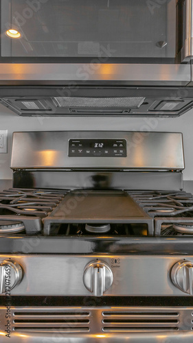 Panorama frame Close up of wall mounted microwave and cooktop of a range inside the kitchen