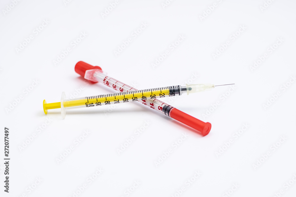 Fototapeta premium Two insulin syringes isolated on white background. Diabetes concept.