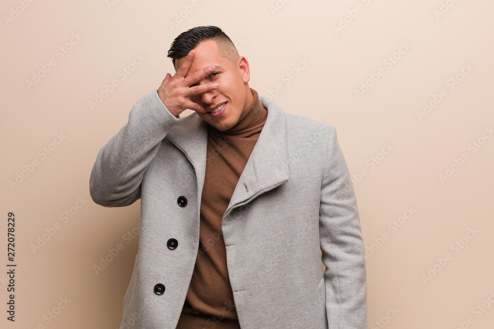Young latin business man embarrassed and laughing at the same time Young latin business man embarrassed and laughing at the same time