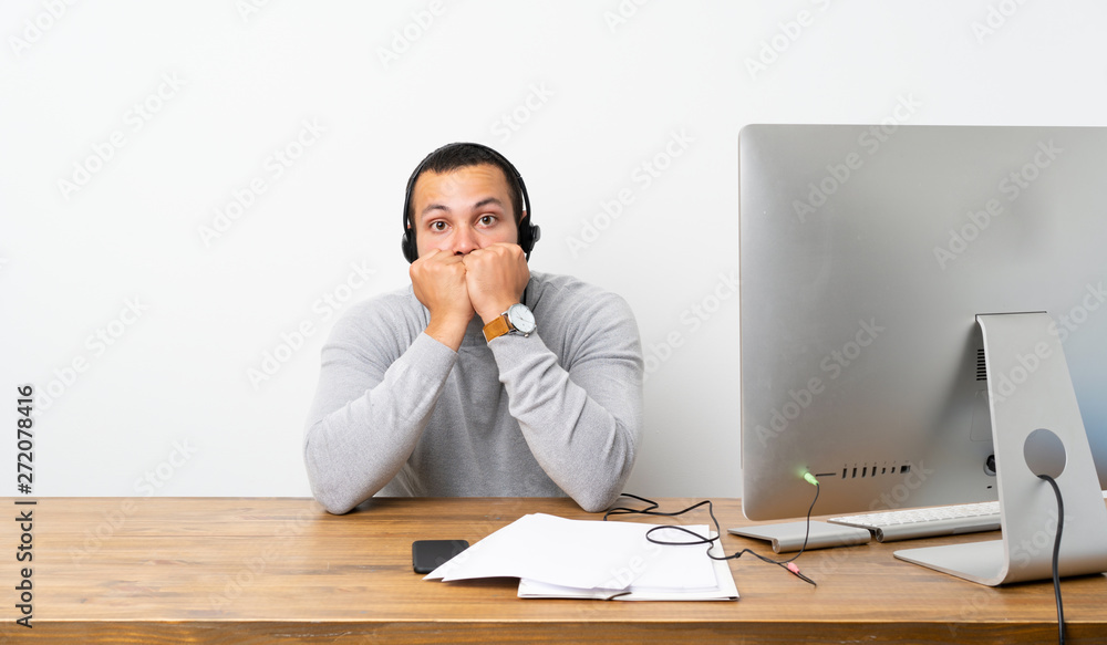 Telemarketer Colombian man nervous and scared putting hands to mouth Telemarketer Colombian man nervous and scared putting hands to mouth