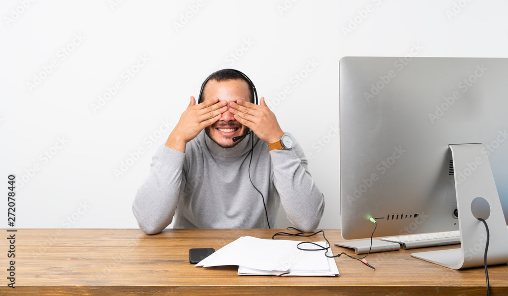 Telemarketer Colombian man covering eyes by hands Telemarketer Colombian man covering eyes by hands