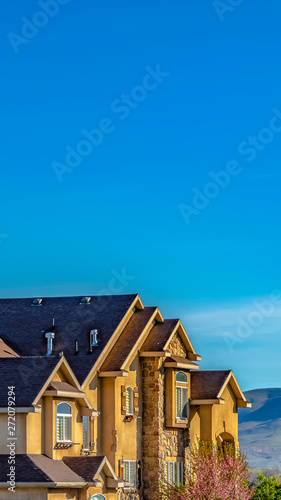 Panorama frame Exterior of lavish house with mountain and blue sky background on a sunny day