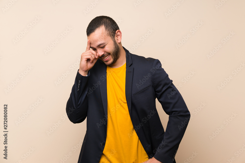 Colombian man over isolated background laughing Colombian man over isolated background laughing