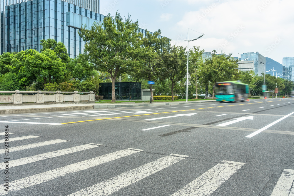 empty road with zebra crossing and skyscrapers in modern city. empty road with zebra crossing and skyscrapers in modern city.