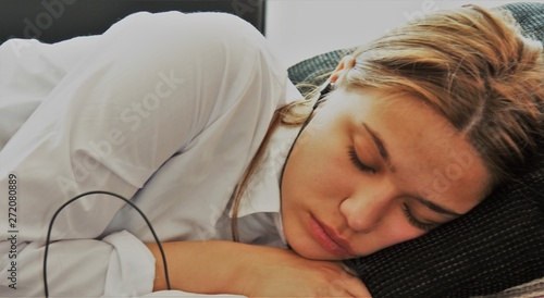 girl sleeping in headphones