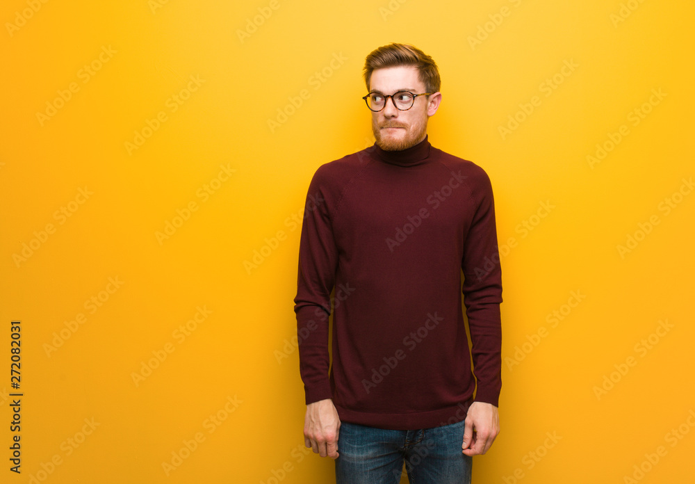 Fototapeta premium Young smart man thinking about an idea