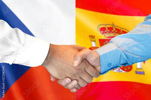 Business handshake on the background of two flags. Men handshake on the background of the Czech Republic and Spain flag. Support concept