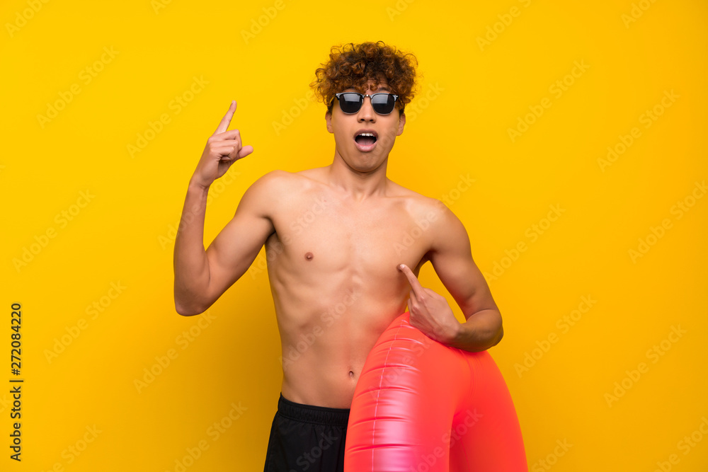 African american man over isolated purple wall with surprise facial expression