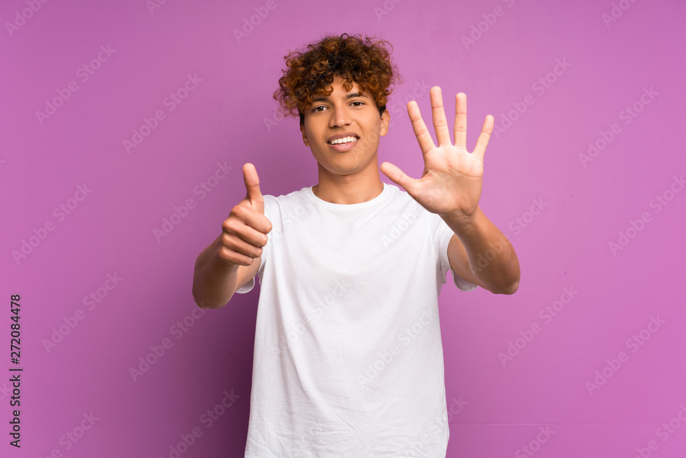 Young african american man over isolated purple wall counting six with fingers Young african american man over isolated purple wall counting six with fingers
