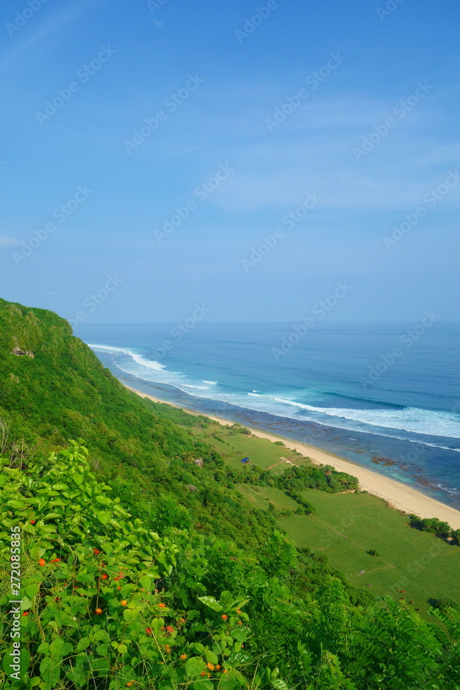 Empty Suluban and Nyang Nyang paradise beach, blue sea waves in Bali island, Indonesia