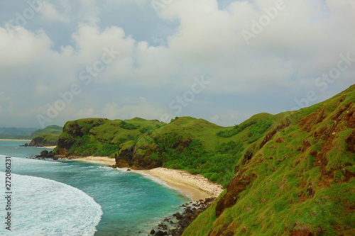 Colorful sunset at Merese Hill with a view of Tanjung Aan in Lombok, Indonesia
