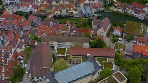 Aerial in Calw, Germany.  Camera rotates right over hillside in the city of Calw, Nagold River and a wooded hillside. photo