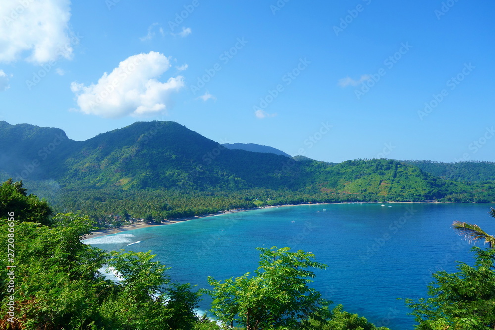 Beautiful landscape of Pantai Nipah, Lombok island scenic travel destination beach with crystal blue waters and coconut trees - near Bali, Indonesia Beautiful landscape of Pantai Nipah, Lombok island scenic travel destination beach with crystal blue waters and coconut trees - near Bali, Indonesia