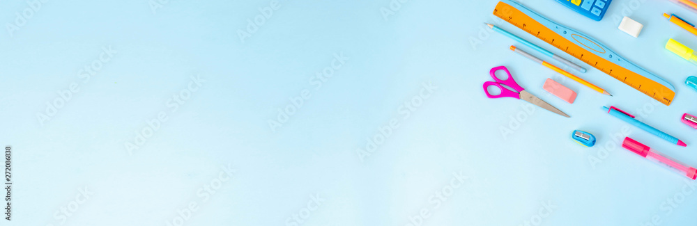 Flat lay from a variety of stationery on a blue background. Flat lay from a variety of stationery on a blue background.
