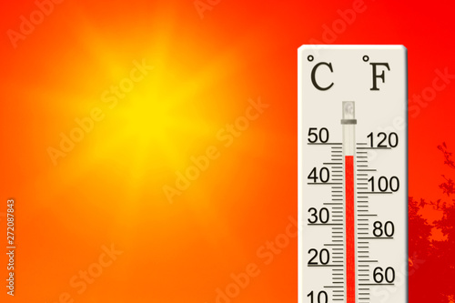 Summer heat. Thermometer shows high temperature in summer
