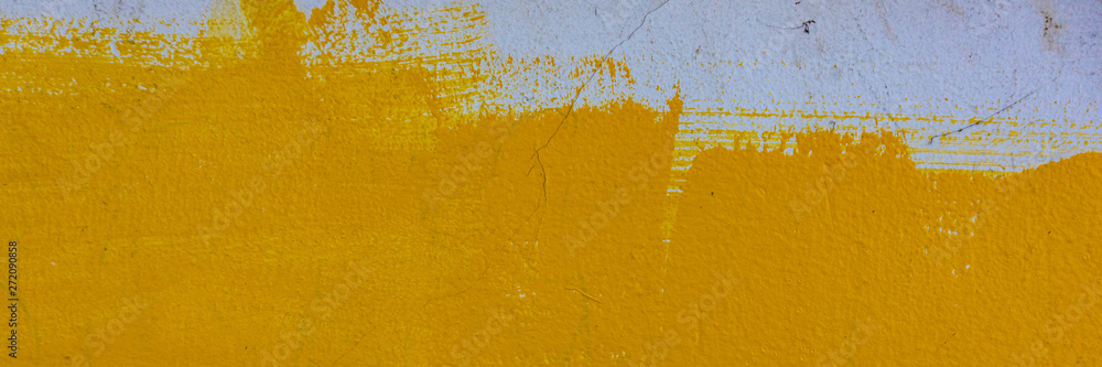Fototapeta cement plaster covered with yellow paint, the surface of the wall.