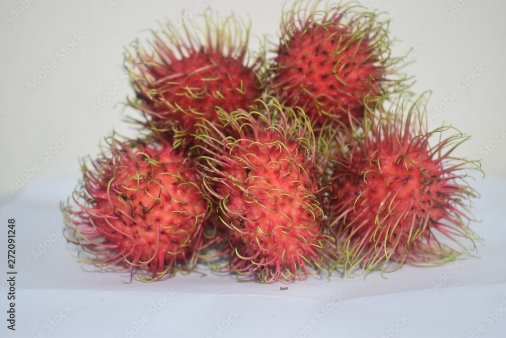 Fresh red rambutans fruit on white colour background Fresh red rambutans fruit on white colour background
