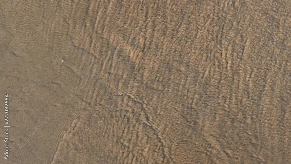 Heart Shapes Being Drawn on Sandy Beach and Wiped Out by Sea Wave at Sunset Heart Shapes Being Drawn on Sandy Beach and Wiped Out by Sea Wave at Sunset
