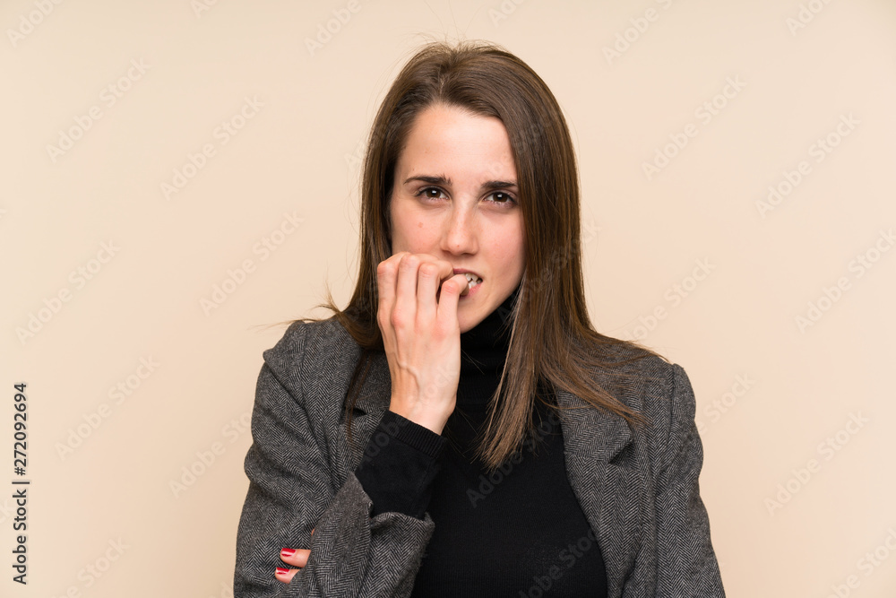 Young woman over isolated wall nervous and scared Young woman over isolated wall nervous and scared