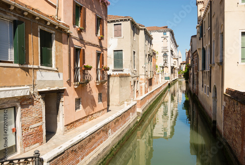 View of the city narrow street, bridge and canal in Venice, Italy