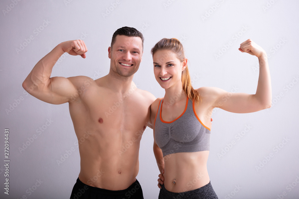 Couple Showing Muscles
