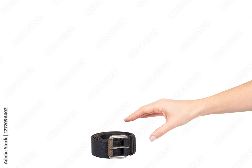 Hand with dark leather belt with metal buckle, male accessory. Hand with dark leather belt with metal buckle, male accessory.
