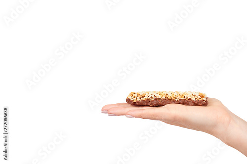 Hand with healthy granola, energy, sport, breakfast and protein bar.