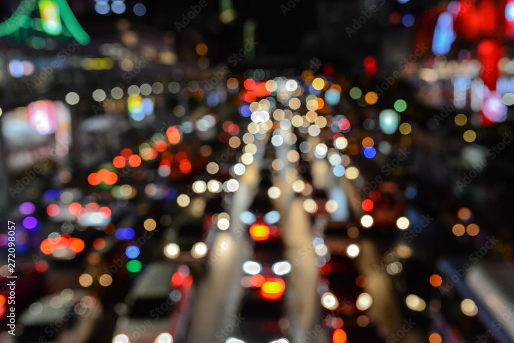 Beautiful night city view, traffic jam, out of focus.