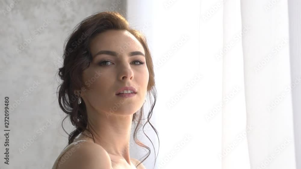 Beautiful Brunette Bride Standing Near The Window Beautiful Brunette Bride Standing Near The Window