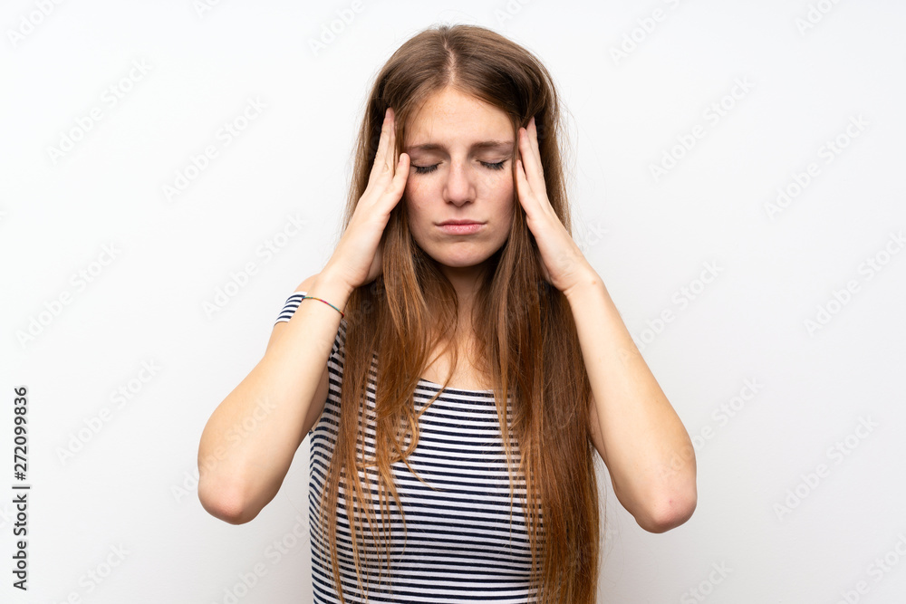 Young woman with long hair over isolated white wall with headache Young woman with long hair over isolated white wall with headache