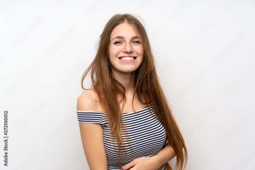 Young woman with long hair over isolated white wall smiling Young woman with long hair over isolated white wall smiling