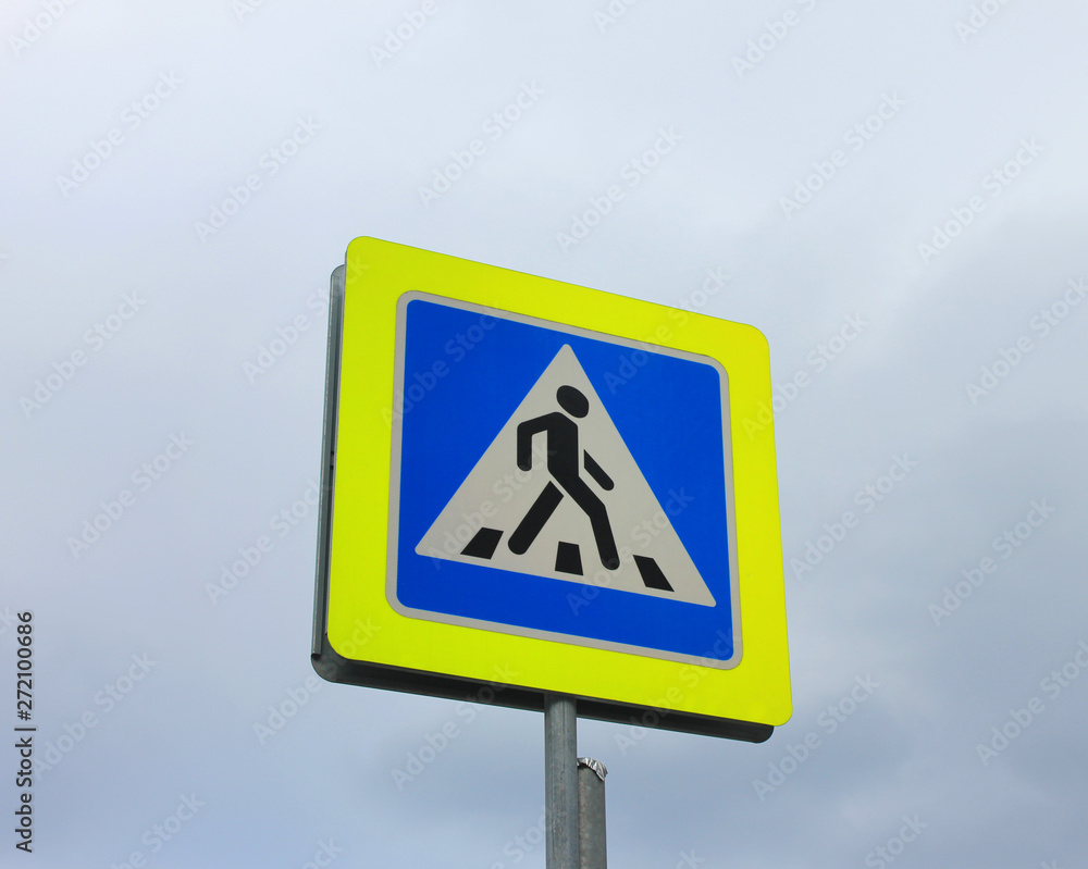 Crosswalk traffic sign with isolated on cloudy sky background 