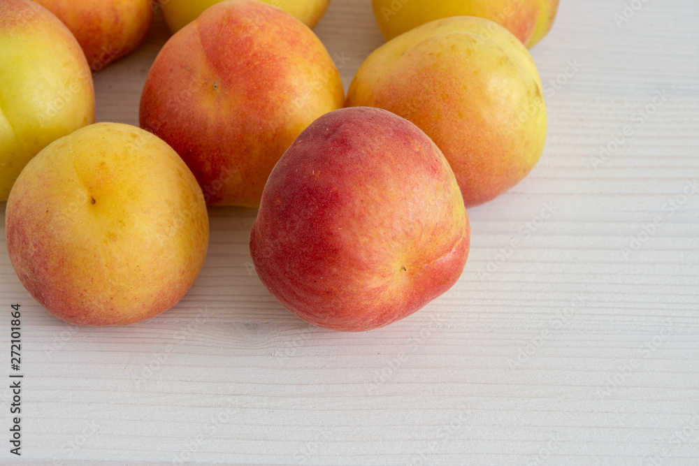 Top view of apricots on white wooden background Top view of apricots on white wooden background