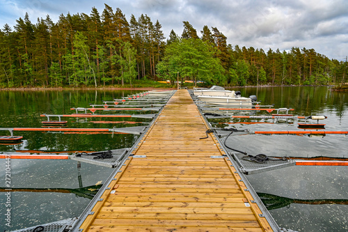 wooden jetty with just a few boats