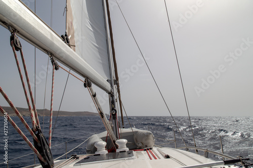 Sailing yacht during the day in the open sea. © Dmitry
