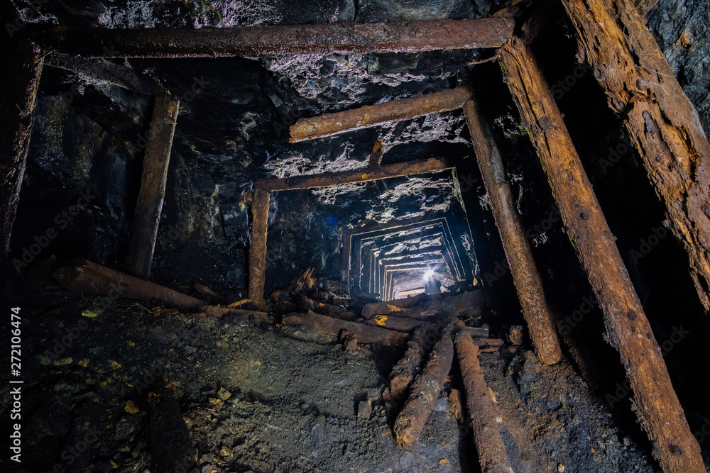 Abandoned coal mine with rotten collapsed wooden miner stands. Old derelict coal development Abandoned coal mine with rotten collapsed wooden miner stands. Old derelict coal development