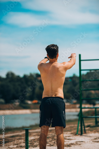 Man strething out muscles before exercise photo