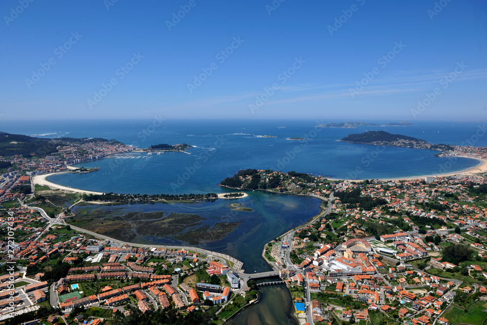  aerial image of the coastal city of baiona in pontevedra, galicia