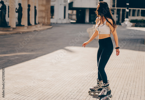 Young woman on roller skates in good weather