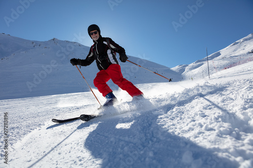 Senior man skiing photo