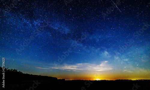 Moon rise against the starry sky.