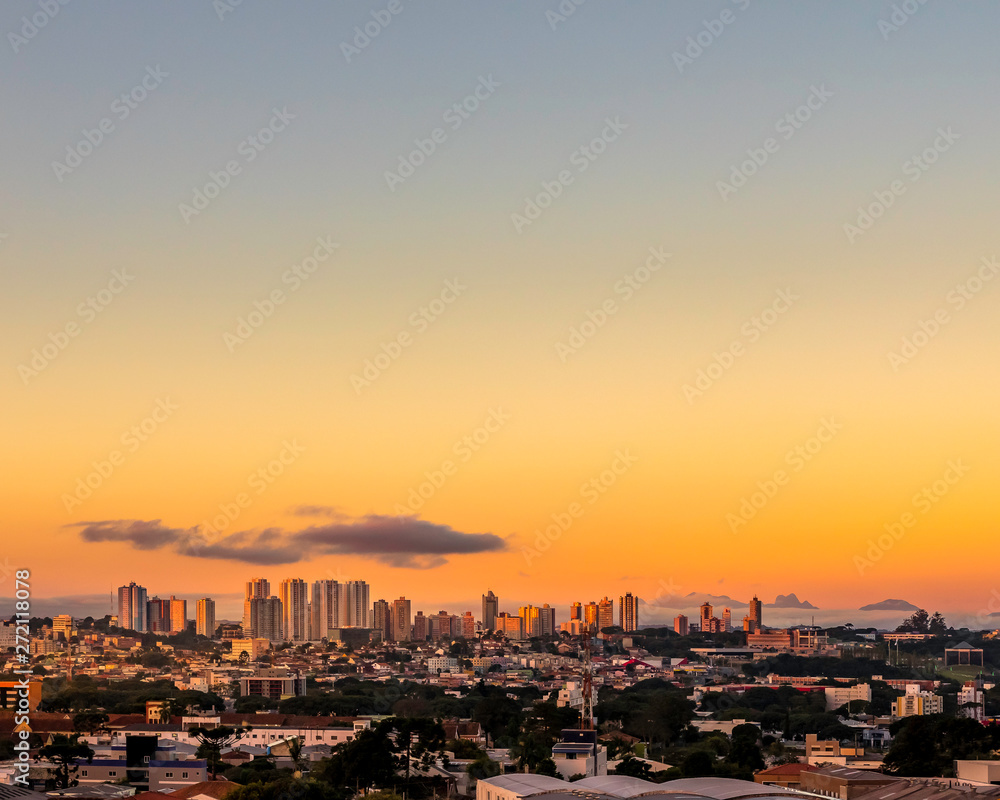 Cityscape with a golden sunrise
