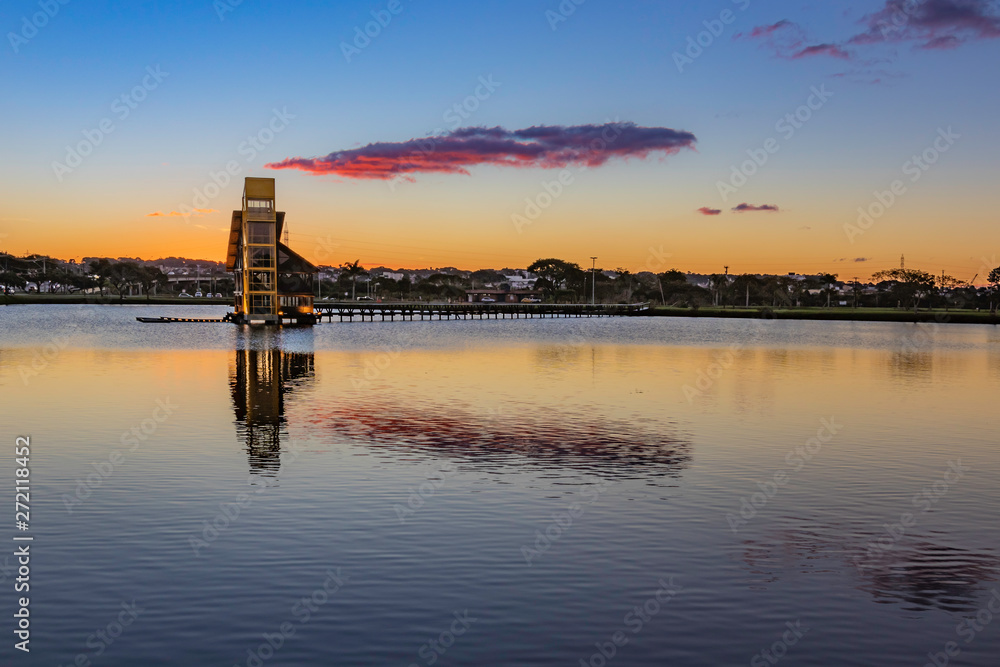 Sunset behind the tower in the lake