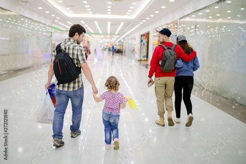 Group of ordinary people walking at the mall