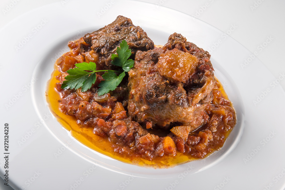 Dish with portion of oxtail stewed Dish with portion of oxtail stewed